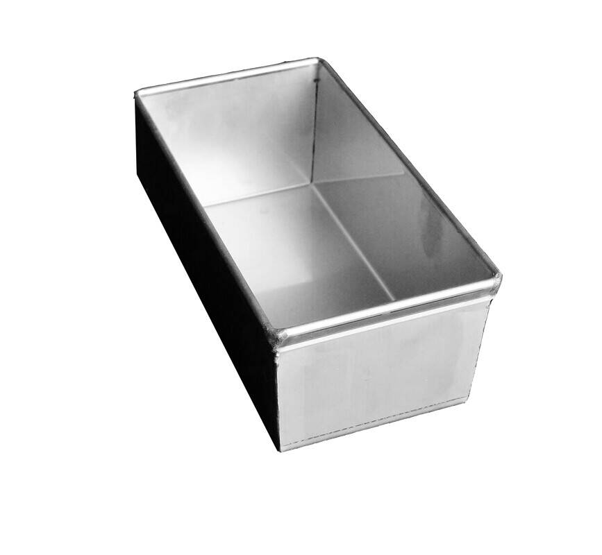 A stainless steel loaf pan with a rectangular shape, ideal for baking bread or cakes and other dishes.